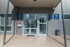 an entrance to a building with a revolving door at MainStay Suites Whyalla in Whyalla