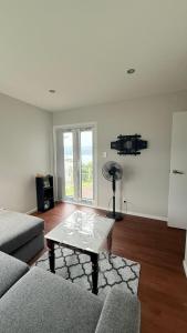 a living room with a couch and a coffee table at Million Dollar View in Wellington