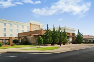 a building with a street in front of it at Homewood Suites by Hilton Macon-North in Wesleyan Hills