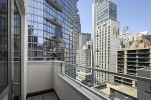 a balcony with a view of the city at Hampton Inn Manhattan Grand Central in New York