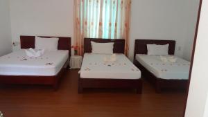 Postel nebo postele na pokoji v ubytování Mango Garden Hoi An Homestay