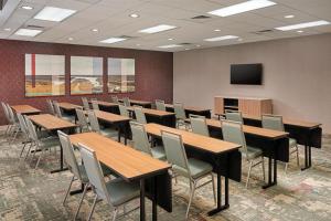 a conference room with tables and chairs and a tv at Homewood Suites by Hilton Macon-North in Wesleyan Hills +23 photos