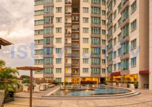 a building with a swimming pool in front of a building at 3BR The BCC Residence 1012 City View in Nagoya