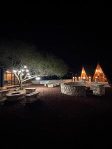 a night time photo of a building with lights at azomalli cabañas in Bernal +7 photos