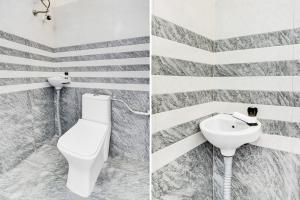 a bathroom with a toilet and a sink at Hotel O SNIST University Hyderabad Formerly Hari Hara Enterprise in Maula Ali