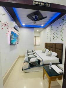 a bedroom with a bed with a blue ceiling at HOTEL SHEKHAR INN Luxury Suit in Agra