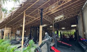 a gym with exercise equipment in a building at Villa Coco Escape in Ko Phangan