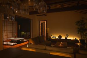 a living room with a couch and a table at Hakone Kairai in Hakone +25 photos