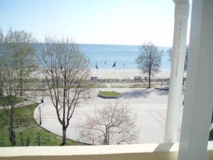 a view of a parking lot with the ocean in the background at Giorgos Apartments Sea View in Olympic Beach