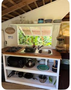 a small kitchen with a sink and a window at Atunumai in Temae