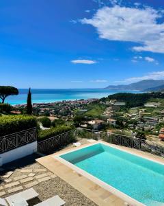 a swimming pool with a view of the ocean at Villa Gaia in Bordighera