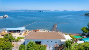 an aerial view of a house and the water at Taean Tteulapbada Pension in Taean