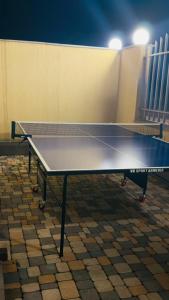 a ping pong table in a room at Miracle View Dilijan in Dilijan