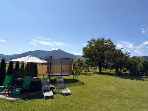 a group of chairs and a table with a tent at Penzion Mlynárov Dvor in Dúbrava