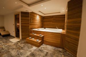 a large bathroom with a tub and a shower at Business Life Hotel & SPA Bakırköy in Istanbul +53 photos