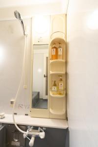 a bathroom with a mirror and a sink at Villa Taniguchi in Takayama +58 photos