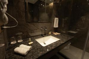 a bathroom with a sink and a shower at Pride Resort Jodhpur in Banār +20 photos