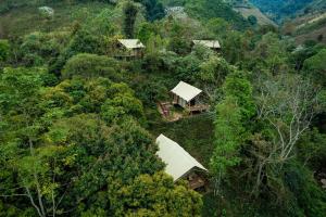 an overhead view of a house in the forest at Visama Explorer Nan in Ban Huai Luk