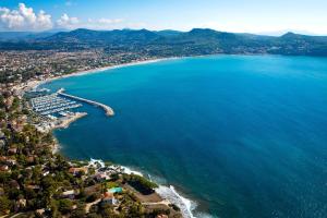 an aerial view of a beach and the ocean at Villa Onyra - Studios, Suites & Villa in Saint-Cyr-sur-Mer