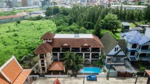 an aerial view of a house with a pool at Westkey Patong Hotel in Patong Beach