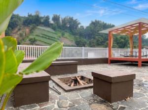 a patio with a fire pit and a gazebo at Heavenly 1 - Private Triangle in Bandung