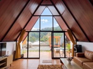 an open living room with a large window at Heavenly 1 - Private Triangle in Bandung
