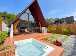 a house with a hot tub on a patio at Heavenly 1 - Private Triangle in Bandung
