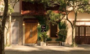 a building with a sign in front of a door at Châu Home in Ninh Binh +23 photos
