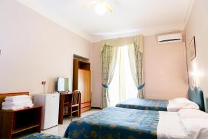 Letto o letti in una camera di Hotel Altavilla 9