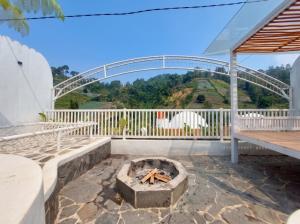 a patio with a fire pit and a bridge at Himalaya 1 - Private Dome in Panjadakan +1 photo