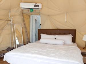 a bedroom with a bed in a tent at Azalea 1 - Private Dome in Bandung