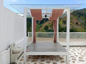 a room with a balcony with a view at Azalea 1 - Private Dome in Bandung +2 photos