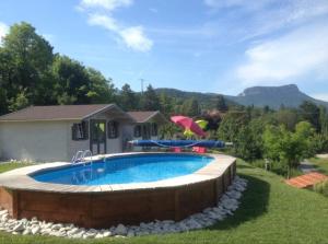 a swimming pool in a yard with a house at Chalet 1 in Aouste-sur-Sye