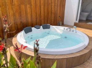 a jacuzzi tub in the middle of a room at Hanara Private Glamping in Panjadakan