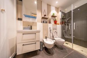 a bathroom with a sink and a toilet and a shower at Loft Elegante nel centro di Dozza, città d'Arte in Dozza