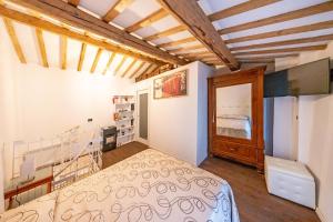a bedroom with a bed in a room at Loft Elegante nel centro di Dozza, città d'Arte in Dozza