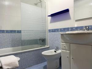 a bathroom with a sink and a toilet and a shower at R2R - El Rincón de Luiña - 310A in Soto de Luiña +31 photos
