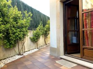 a door to a building with a fence and trees at R2R - El Rincón de Luiña - 310A in Soto de Luiña
