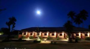 a building at night with the moon in the sky at Pilton Resort in Ban Huai Yang +14 photos