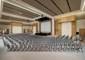 a large auditorium with chairs and a screen at Akra Didim Resort & SPA in Didim +131 photos