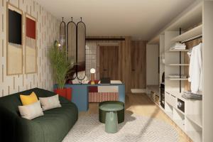 a living room with a green couch and a table at Aura by Aubamar in Playa de Palma
