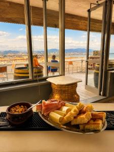 a plate of food on a counter in front of a window at Allegroitalia La Spezia 5 Terre in La Spezia