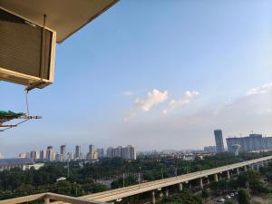 a view of the city from a building at Sunlit Omaxe ITC, Greater Noida in Greater Noida