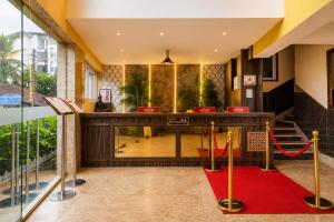 a lobby of a hotel with a red carpet at Summit Calangute Resort & Spa in Calangute