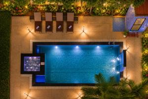 an overhead view of a swimming pool with lights at Summit Calangute Resort & Spa in Calangute