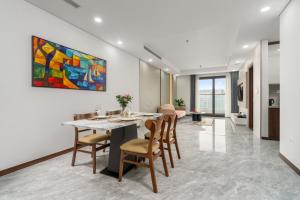 a dining room with a table and chairs at Caballos Apartment Capital Elite in Hanoi