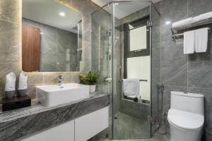 a bathroom with a toilet and a sink and a shower at Caballos Apartment Capital Elite in Hanoi