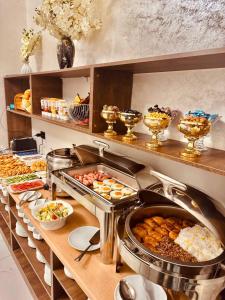 a buffet with many different types of food at The Moonya Hotel in Samarkand