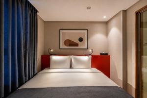 a hotel room with a bed and a window at Best Western Insadong Hotel in Seoul +31 photos