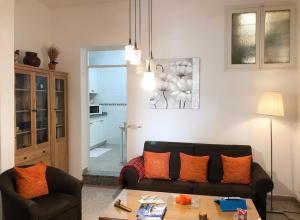 a living room with a couch and a table at Charming house in Teror with garden in Teror